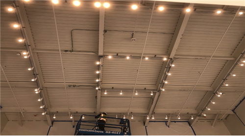 Track lights being installed at the RH building at JAMS PAC. 